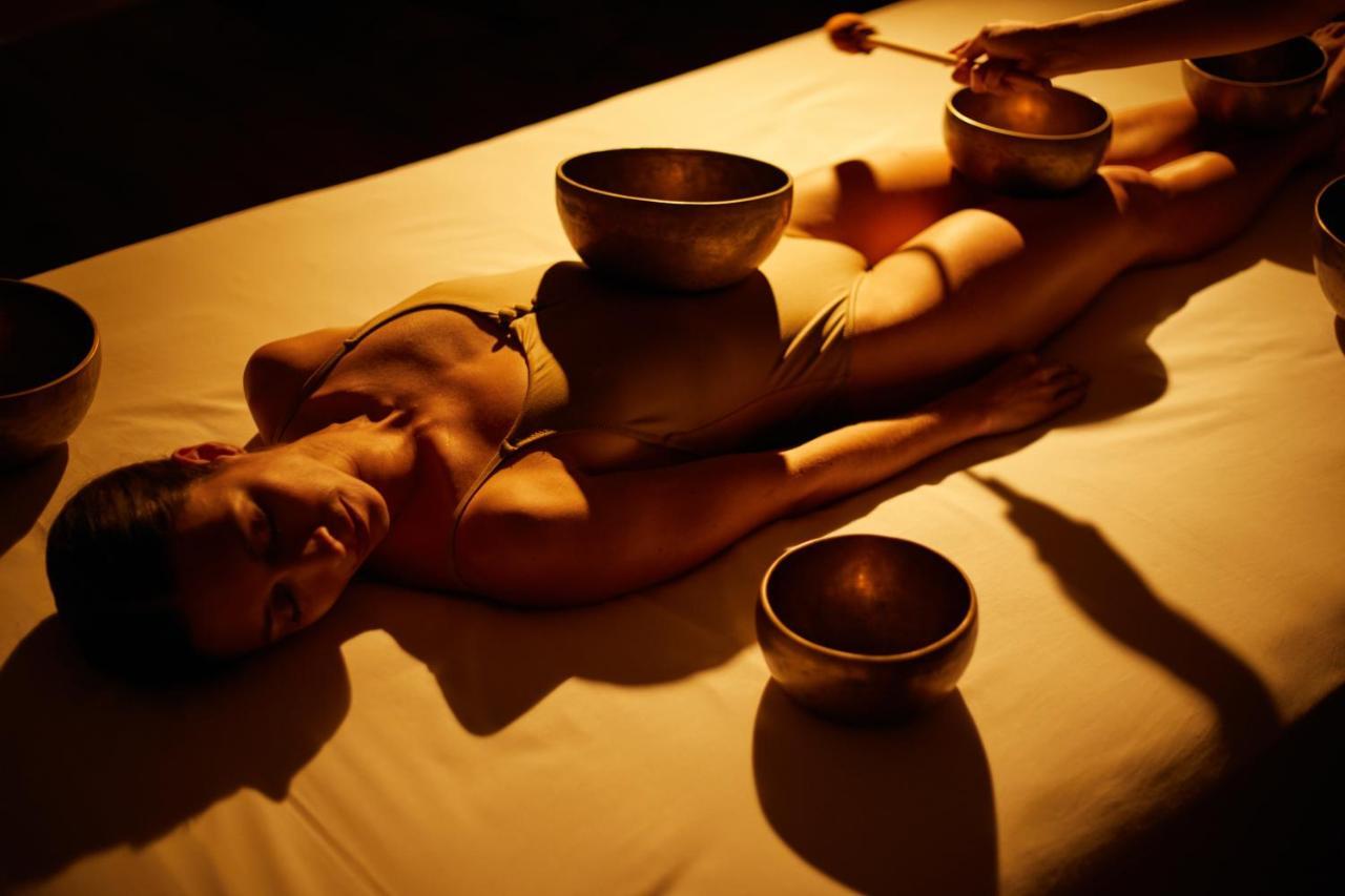Secrets Lanzarote Resort & Spa - Adults Only Puerto Calero Luaran gambar A woman receiving a singing bowl massage